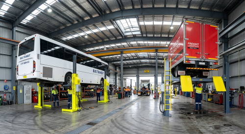 Heavy duty column lifts and four-post lift for trucks and buses in a commercial workshop